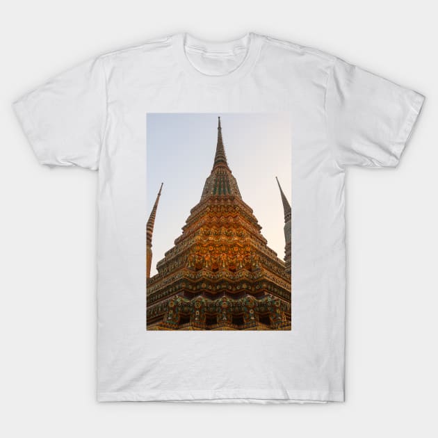 Low angle view of a Buddha stupa reaching symmetrical in the clear sky. T-Shirt by kall3bu